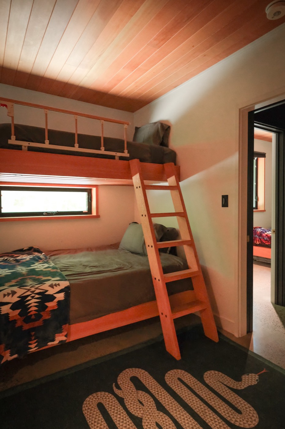 Black Oak Lodge floor-to-ceiling windows overlooking the lake